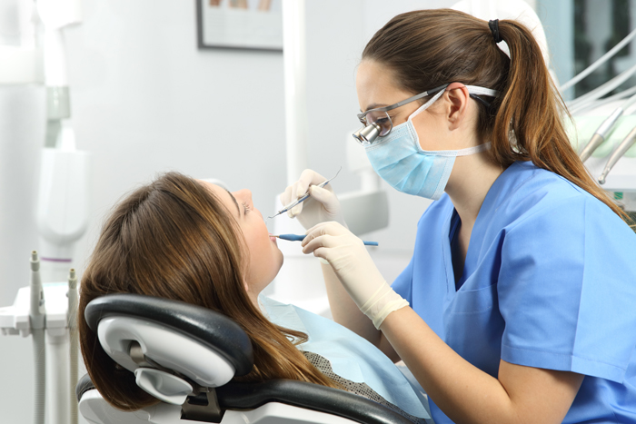 Dentist examining a patient teeth Dental Hygienist, Dibden Purlieu